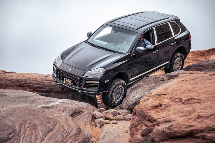 Lifted Porsche Cayenne on trail with increased ground clearance and off-road stance from Berg Peaks lift kit
